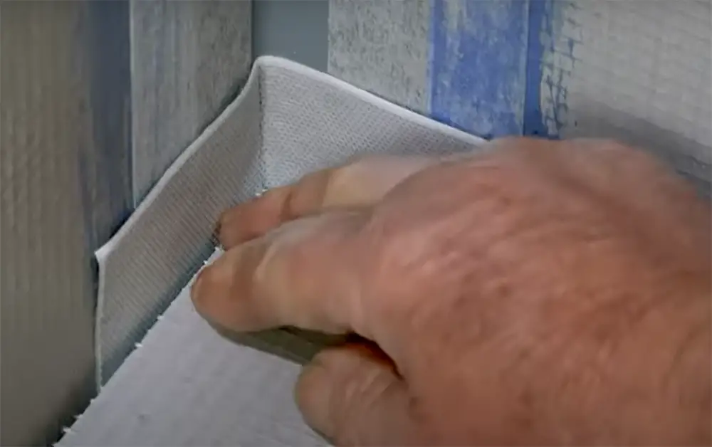 Seal the sides of your shower niche with fiberglass tape
