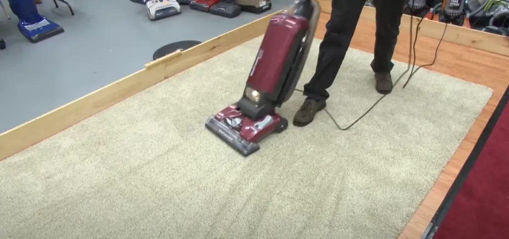 How can I increase the effectiveness of vacuuming the rug?